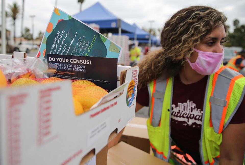 PARAMOUNT, CALIFORNIA - AUGUST 06: A pamphlet with 2020 census information is included in a box of food to be distributed by the Los Angeles Regional Food Bank to people facing economic or food insecurity amid the COVID-19 pandemic on August 6, 2020 in Paramount, California. Around 2,500 motorists were expected to collect the food boxes which included the pamphlet urging recipients to complete the 2020 census as the spread of the coronavirus continues. The problem of food insecurity is increasing with almost 30 million respondents telling the U.S. Census Bureau they did not have enough to eat at some point during the week ending July 21. (Photo by Mario Tama/Getty Images)