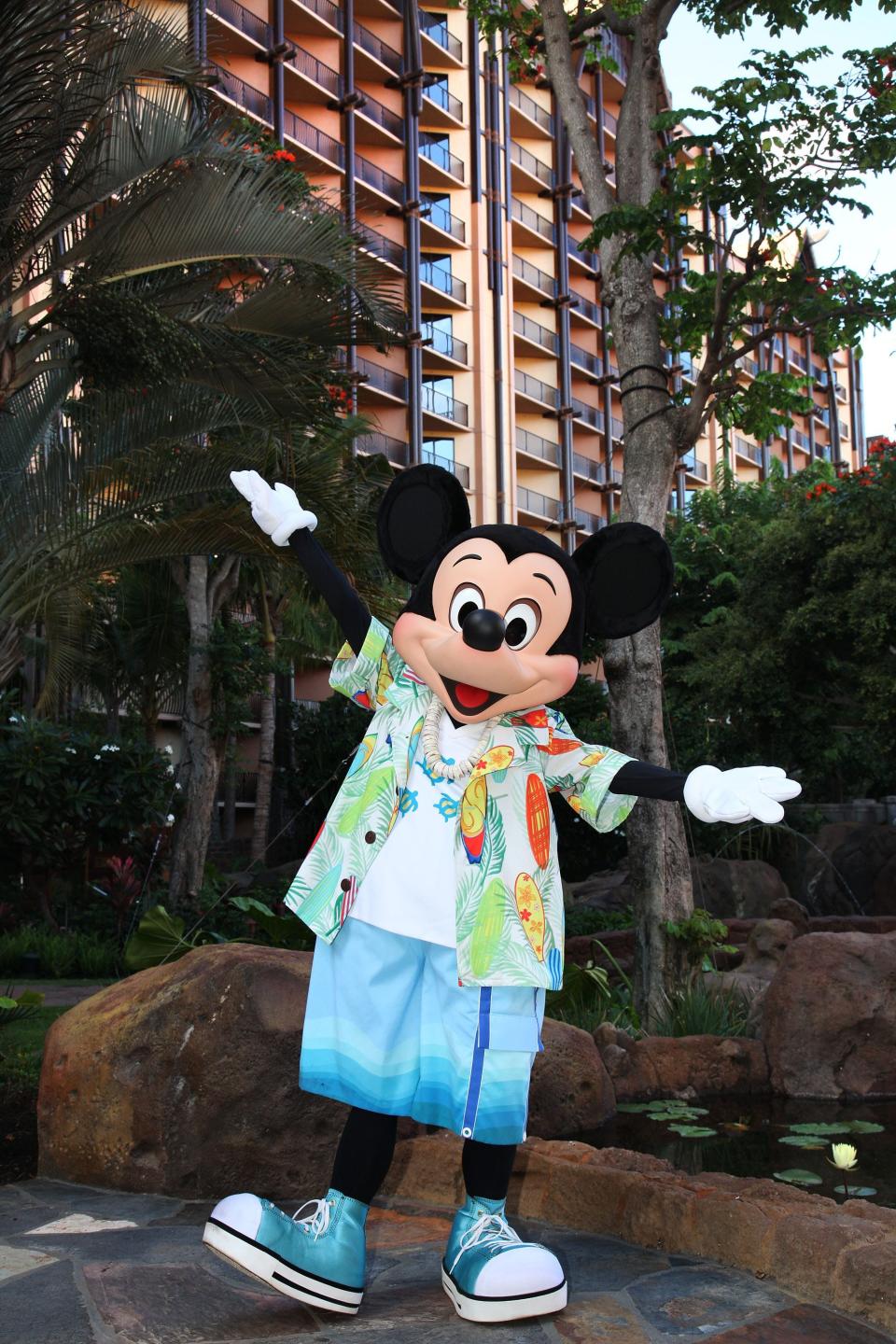 Mickey Mouse opens his arms wide at Aulani, A Disney Resort & Spa. The DVC property there is called Aulani A Disney Vacation Club Resort in Hawaiʻi.