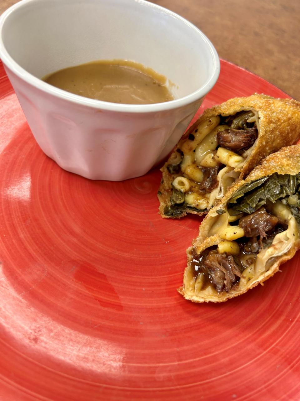 While much of the menu at Chef's Kitchen in Cocoa is traditional soul food, chef Mike Blackwell likes to get creative sometimes. This is the Soul Roll, oxtail, mac and cheese and collard greens stuffed into an eggroll wrapper, fried and served with a side of gravy.