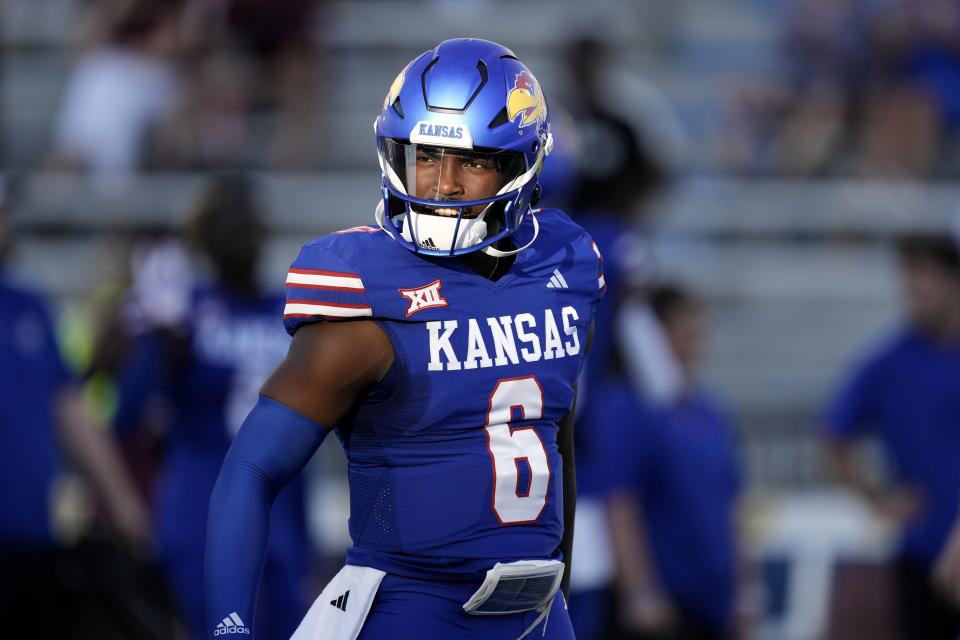 Kansas quarterback Jalon Daniels warms up before an NCAA college football game against Missouri State Friday, Sept. 1, 2023, in Lawrence, Kan. (AP Photo/Charlie Riedel)