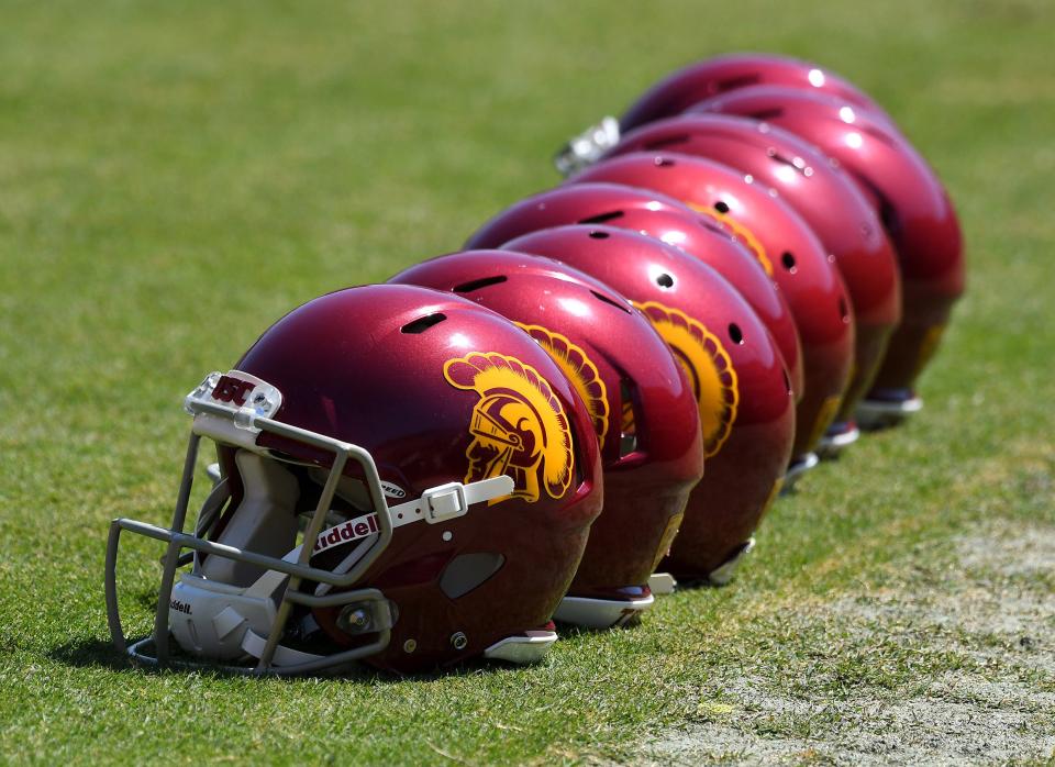 A view of USC football helmets on the field at the LA Coliseum.