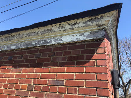 Paint -- which was found to contain 16 per cent lead -- peels from an abandoned switch house in Fort Knox, Kentucky, U.S. April 12, 2018. REUTERS/Joshua Schneyer