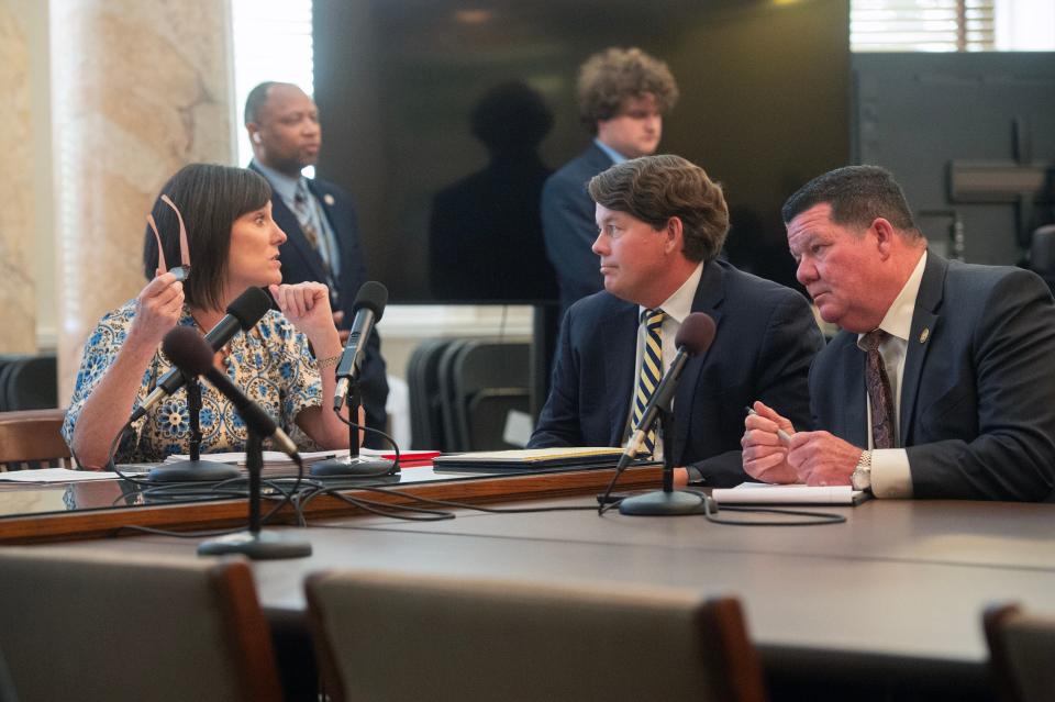 Reps. Missy McGee, R-Hattiesburg, from left, Joey Hood, R-Ackerman, and Sam Creekmore, R-New Albany, confer before the Conference Committee for Medicaid Expansion Committee meeting at the Mississippi State Capitol Thursday. The Senate Medicaid conference committee members have now submitted a counter to the House plan, with only one key difference remaining between the plans.