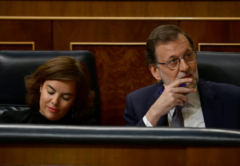 Spanish Vice President Soraya Saenz de Santamaria (L) and interim Prime Minister Mariano Rajoy pictured at the Congress (Las Cortes) in Madrid on August 31, 2016