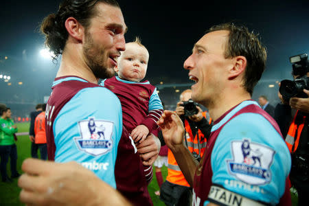 Britain Soccer Football - West Ham United v Manchester United - Barclays Premier League - Upton Park - 10/5/16West Ham's Andy Carroll celebrates with his child and Mark Noble after the matchReuters / Eddie Keogh