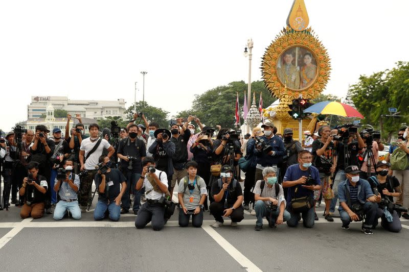 Members of the media are seen covering anti-government protests in Bangkok