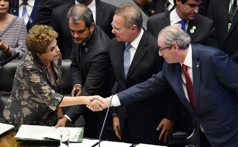 Former president of the Chamber of Deputies Eduardo Cunha (R) launched the impeachment of ex-leftist president Dilma Rousseff (L)