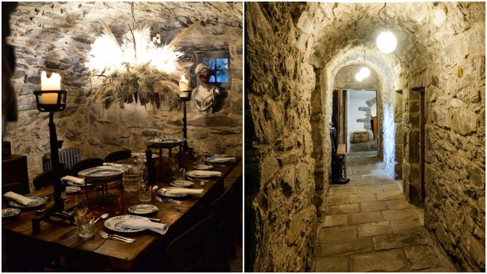 The interior dining room and hallway of Kilmartin Castle, which are surrounded by rock walls.