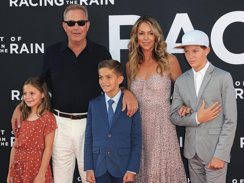 Grace Avery Costner, Kevin Costner, Hayes Logan Costner, Christine Baumgartner and Cayden Wyatt Costner arrive for the Premiere Of 20th Century Fox's "The Art Of Racing In The Rain" held at El Capitan Theatre on August 1, 2019 in Los Angeles, California