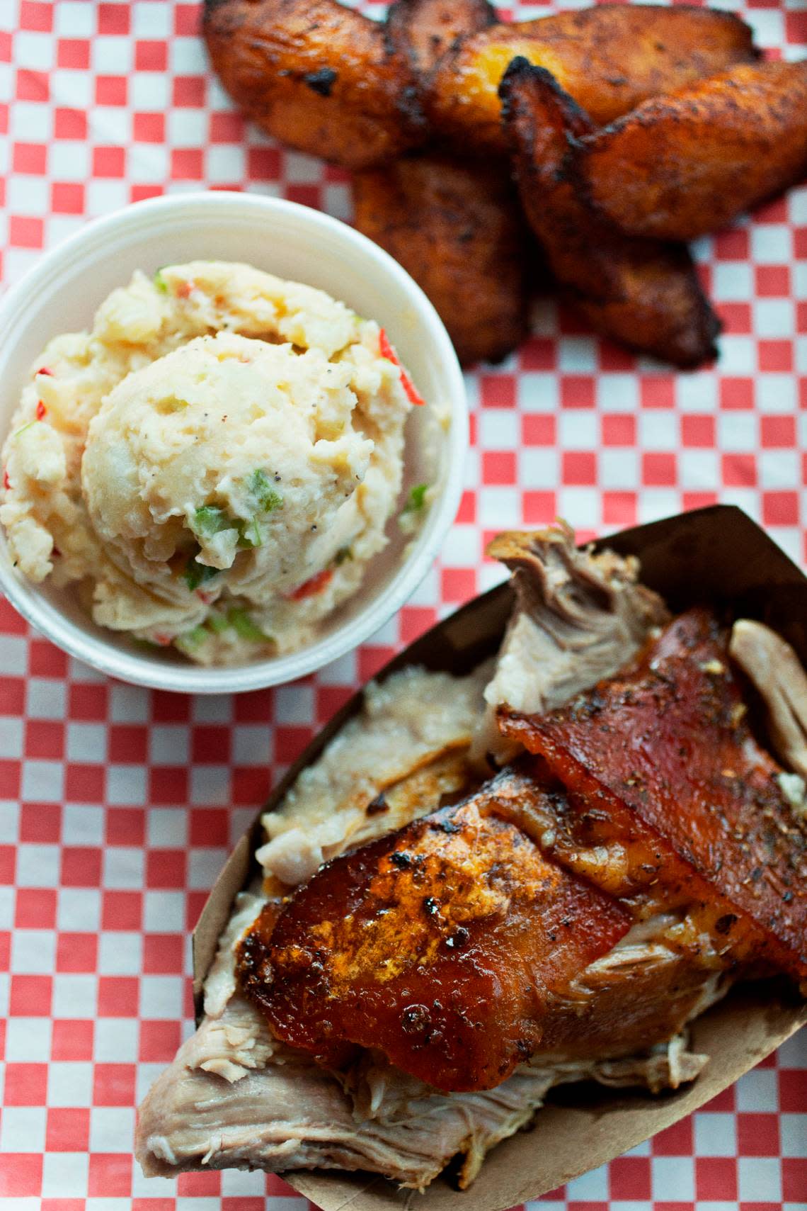 Lechon with a side of plantains and Latin potato salad at Lechon Latin BBQ Joint in Raleigh’s Triangle Town Center.