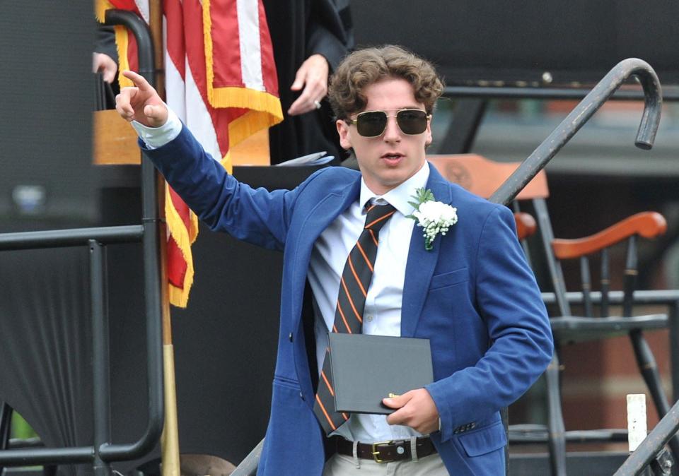 With diploma in hand, James Foley celebrates during the Thayer Academy commencement in Braintree on Saturday, June 10, 2023.