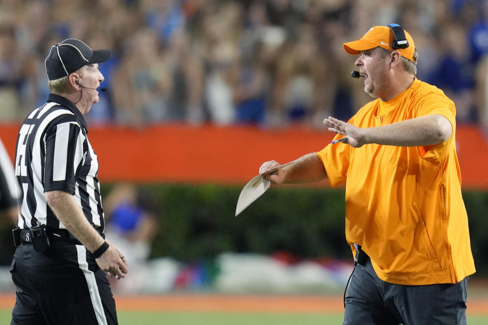 Tennessee head coach Josh Heupel, right, has words with head lineman Gary Jaroe, left, after a penalty was called on Tennessee during the second half of an NCAA college football game against Florida, Saturday, Sept. 16, 2023, in Gainesville, Fla. (AP Photo/John Raoux)