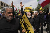 Worshippers chant slogans during a protest against Sweden after the Nordic nation allowed an Iraqi man to insult the Muslim holy book, the Quran, after their Friday prayers in Tehran, Iran, Friday, July 21, 2023. (AP Photo/Vahid Salemi)