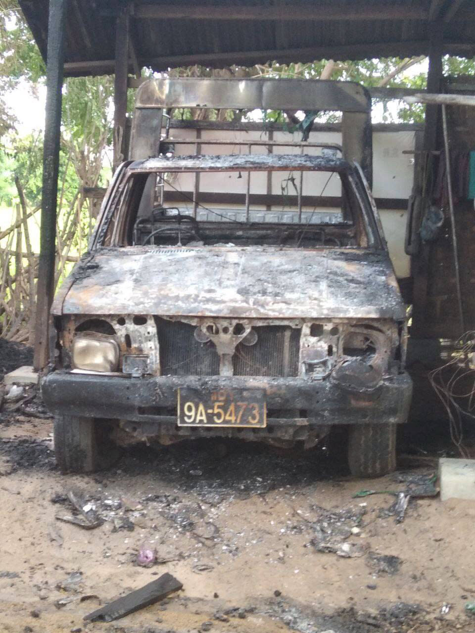 A burnt vehicle stands within a monastery that houses a middle school in Let Yet Kone village in Tabayin township in the Sagaing region of Myanmar on Saturday, Sept. 17, 2022, the day after an air strike hit the school. The attack killed a number of adults and children, according to a school administrator and volunteers assisting displaced people. (AP Photo)