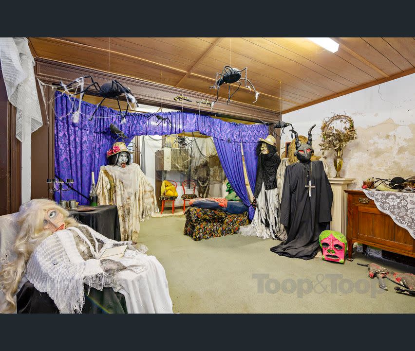 Creepy decorations in the cellar of the Macgill house for sale. (Image: realestate.com.au/Toop & Toop)