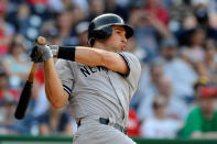 WASHINGTON, DC - JUNE 16: Mark Teixeira #25 of the New York Yankees hits a two run double in the fourteenth inning against the Washington Nationals at Nationals Park on June 16, 2012 in Washington, DC. (Photo by Patrick McDermott/Getty Images)