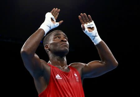 2016 Rio Olympics - Boxing - Quarterfinal - Men's Light Heavy (81kg) Quarterfinals Bout 200 - Riocentro - Pavilion 6 - Rio de Janeiro, Brazil - 14/08/2016. Joshua Buatsi (GBR) of Britain reacts after his bout. REUTERS/Peter Cziborra