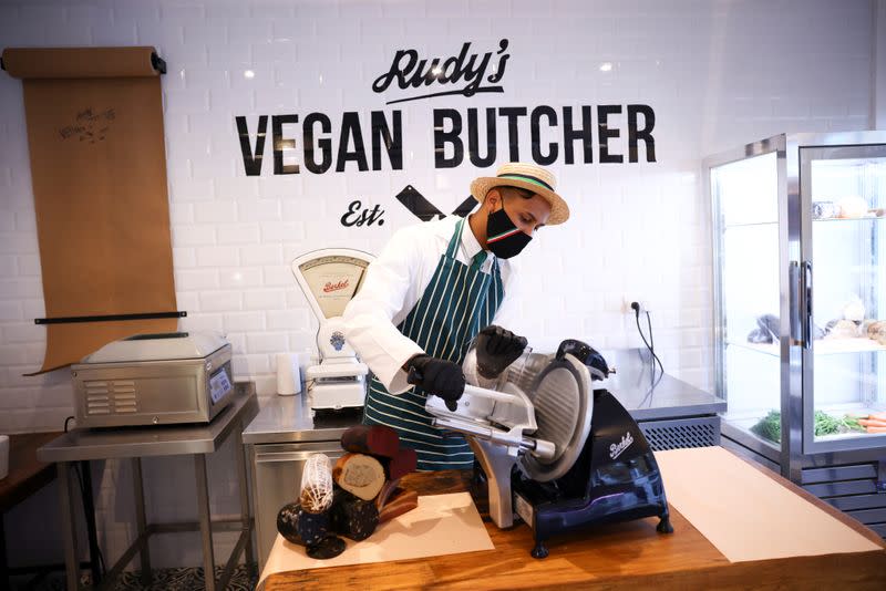 A member of staff works inside 'Rudy's Vegan Butcher' shop, amid the coronavirus (COVID-19) outbreak, in London