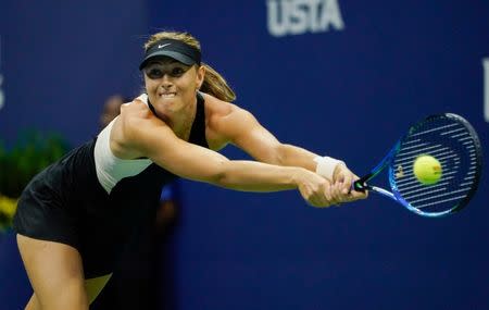 Sept 1, 2018; New York, NY, USA; Maria Sharapova of Russia hits to Jelena Ostapenko of Latvia in a third round match on day six of the 2018 U.S. Open tennis tournament at USTA Billie Jean King National Tennis Center. Mandatory Credit: Robert Deutsch-USA TODAY Sports