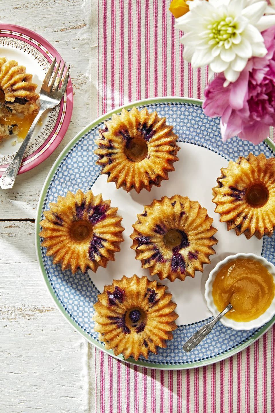 <p>Mom will love these bite-sized bundt cakes that she can cover with as much sweet lemon curd as she pleases.</p><p><strong><a href="https://www.countryliving.com/food-drinks/a27245094/meyer-lemon-blueberry-cake-recipe/" rel="nofollow noopener" target="_blank" data-ylk="slk:Get the recipe for Meyer Lemon-Blueberry Cake;elm:context_link;itc:0;sec:content-canvas" class="link ">Get the recipe for Meyer Lemon-Blueberry Cake</a>.</strong> </p>