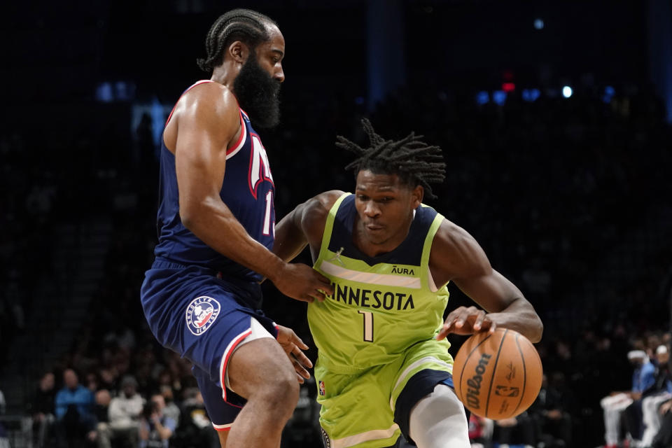 Minnesota Timberwolves forward Anthony Edwards (1) drives against Brooklyn Nets guard James Harden during the first half of an NBA basketball game Friday, Dec. 3, 2021, in New York. (AP Photo/Mary Altaffer)