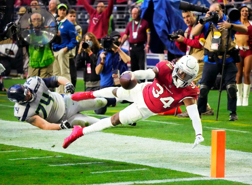 Arizona Cardinals free safety Jalen Thompson dives just short of the goal line after intercepting a pass against the Seattle Seahawks in the second half at State Farm Stadium on Jan. 9, 2022.