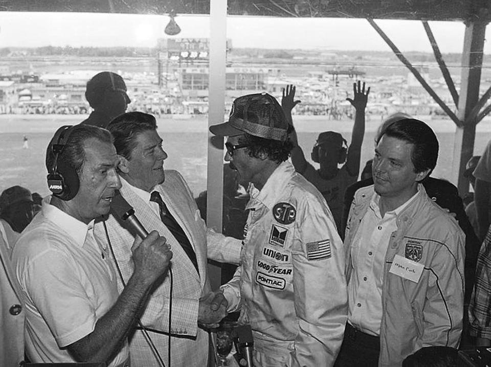 FILE - President Ronald Reagan congratulates stock car driver Richard Petty, who won the Firecracker 400 race at the Daytona International Speedway in Daytona Beach, Fla., July 4, 1984. (AP Photo/Ira Schwarz, File)