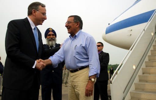 US Ambassador to Singapore David Adelman (left) greets Secretary of Defense Leon Panetta upon his arrival at Paya Lebar Airfield in Paya Lebar, Singapore. Panetta was in Singapore to attend the 11th Aisia Security Summit. Panetta has visited a major base used by US forces in the Vietnam War, as Washington seeks to deepen ties with its former enemy to counter a more assertive posture from China