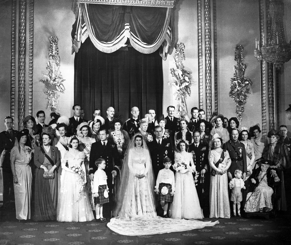 FILE - In this Nov. 20, 1947 file photo, Princess Elizabeth and her husband the Duke of Edinburgh pose with royal guests after their wedding, at Buckingham Palace in London, England. Buckingham Palace says Prince Philip, husband of Queen Elizabeth II, has died aged 99. (AP Photo/File)