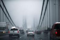 Cars make their way through the Washington bridge in New York November 26, 2014. REUTERS/Eduardo Munoz