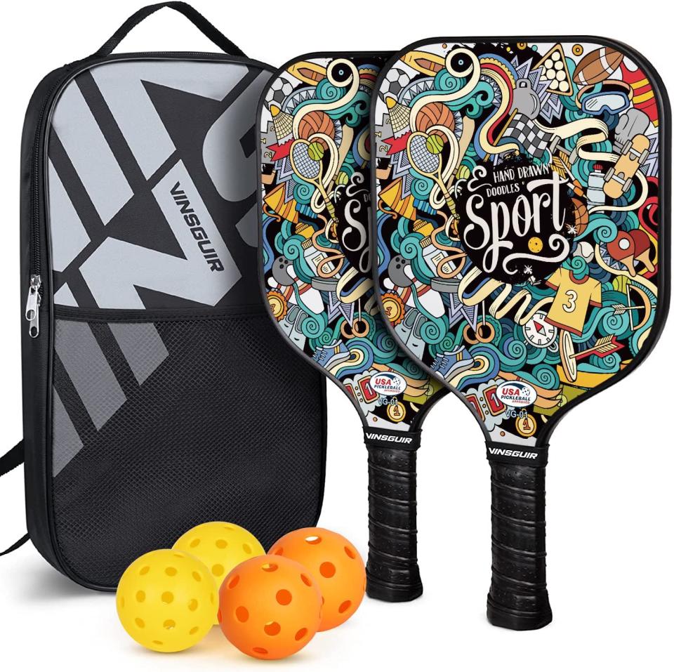 Two-pack of pickleball paddles with four plastic balls and a black carrying case