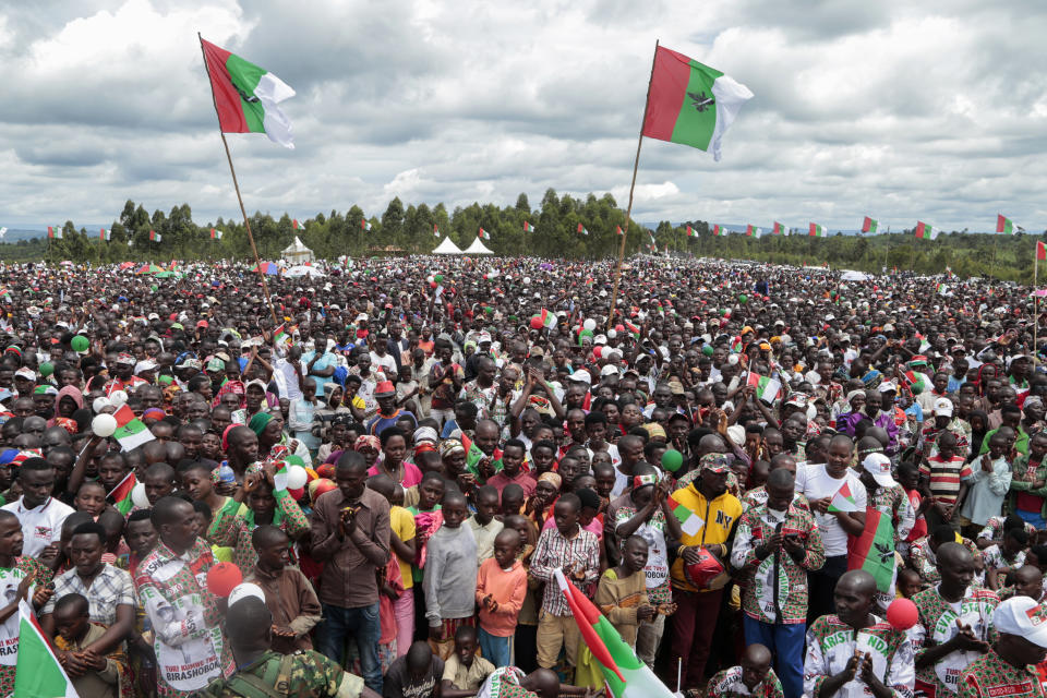 FILE - In this April 27, 2020, file photo, crowds of supporters of the ruling party gather for the start of the election campaign, in Bugendana, Gitega province, Burundi. Burundi is pushing ahead with an election in this month that will end President Pierre Nkurunziza's divisive and bloody 15-year rule but the coronavirus poses a threat to the May 20, 2020 vote which could be the first truly peaceful transfer of authority in the central African nation that has seen coups and ethnic fighting since independence in 1962. (AP Photo/Berthier Mugiraneza, File)