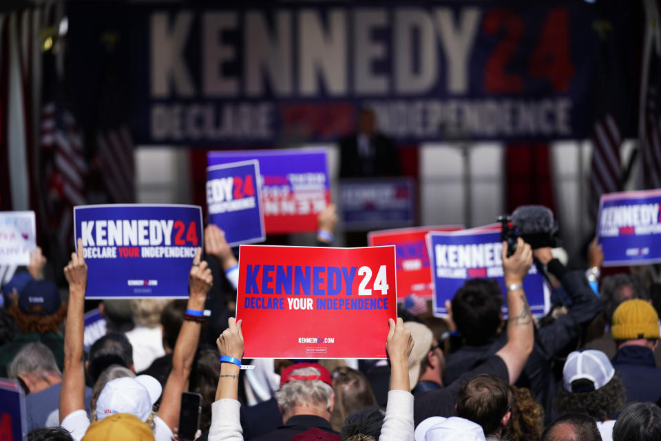 FILE - Supporters react as Independent presidential candidate Robert F. Kennedy Jr. speaks during a campaign event at Independence Mall, Oct. 9, 2023, in Philadelphia. The 60th anniversary of President John F. Kennedy's assassination, marked on Wednesday, Nov. 22, 2023, arrives at an unusual moment for the Kennedy family, one when its mission to uphold a legacy of public service and high ideals competes for attention with the presidential candidacy of Robert F. Kennedy Jr., whose anti-vaccine advocacy and inflammatory comments about everything from the Holocaust to the pandemic have led to a rare public family breach. (AP Photo/Matt Rourke, File)