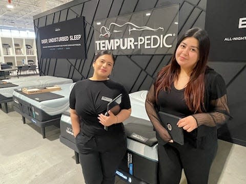 Sales associates Melanie Huerta, left, and Daisy Ramos at the newly opened Mor Furniture for Less store in the Jess Ranch Marketplace in Apple Valley.