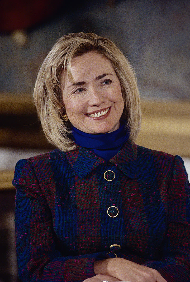 Hillary Clinton in a blue and red outfit for an official first lady portrait taken in 1992