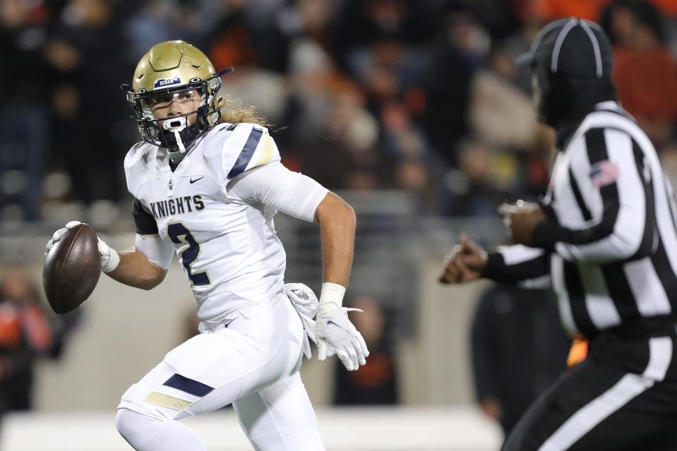 Hoban wide receiver Jayvian Crable runs into the end zone to score after a first-half catch during an OHSAA Division II state semifinal against Massillon, Friday, Nov. 25, 2022, in Akron.