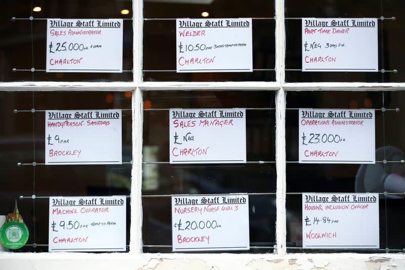 Adverts are seen in the window of a job agency in London