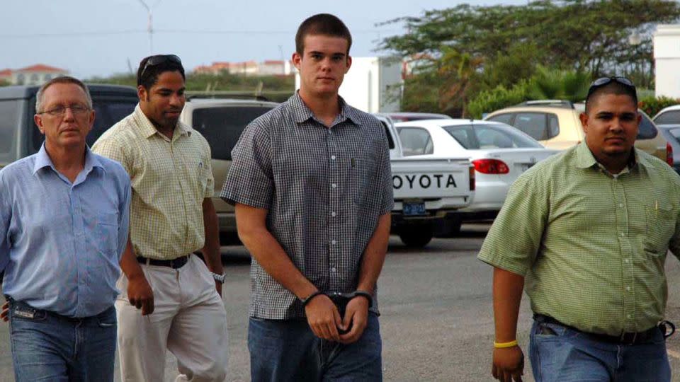 Joran van der Sloot, center, arrives for DNA testing on July 20, 2005, in Oranjestad, Aruba. - Dino Tromp/AP