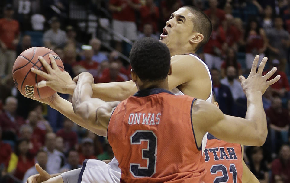 Arizona's Nick Johnson is fouled while shooting by Utah's Princeton Onwas (3) during the first half of an NCAA college basketball game in the quarterfinals of the Pac-12 Conference tournament, Thursday, March 13, 2014, in Las Vegas. (AP Photo/Julie Jacobson)