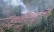 In this image made from video by the Transborder News, smoke rises from a Myanmar Army camp near the border of Myanmar and Thailand Tuesday, April 27, 2021. Ethnic Karen guerrillas said they captured a Myanmar army base Tuesday in what represents a morale-boosting action for those opposing the military's takeover of the country's civilian government in February. (Transborder News via AP)