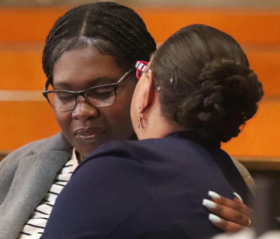 Jada Walker, Jayland Walker's sister, is comforted by Akron NAACP President Judi Hill during a press conference Monday at St. Ashworth Temple Church of God in Christ.