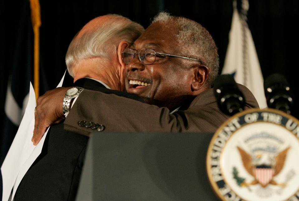 Vice President Joe Biden gets a hug from with U.S. Rep. Jim Clyburn, D-SC, during the dedication ceremony of the new Ernest F. Hollings Special Collections Library Friday, July 23, 2010, in Columbia, S.C.    (AP Photo/Mary Ann Chastain)