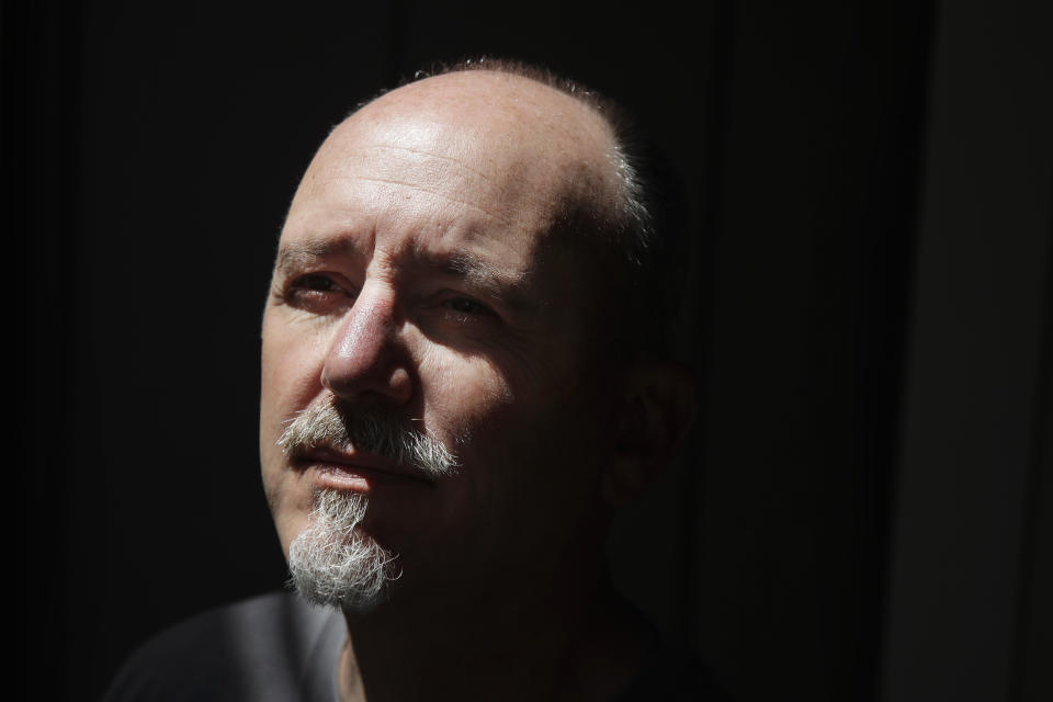 Tom Hicks, a furloughed employee from Luminalt Solar Energy Solutions, poses for a portrait in San Francisco, Tuesday, April 28, 2020. The solar technician has been collecting benefits but no salary — and he's worried about mortgage payments. “My 401k got crushed by 30% just like everyone else," said Hicks, 55. “How much time do I have to recover?” (AP Photo/Jeff Chiu)