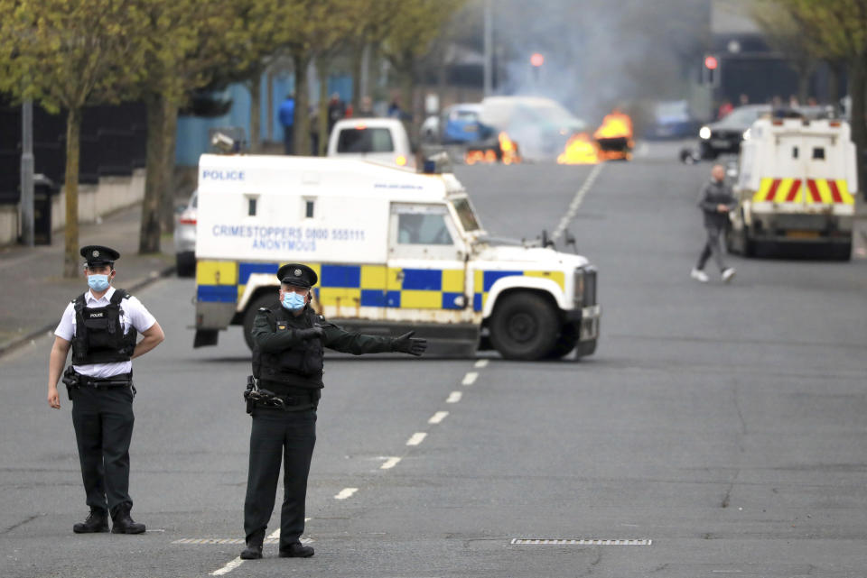 <p>Police divert traffic from a Loyalist protest in Lanark Way in West Belfast, Northern Ireland, Monday, April 19, 2021. Loyalist protesting on the Brexit agreement with the Northern Ireland Protocol have resumed across various locations in the British province. (AP Photo/Peter Morrison)</p>
