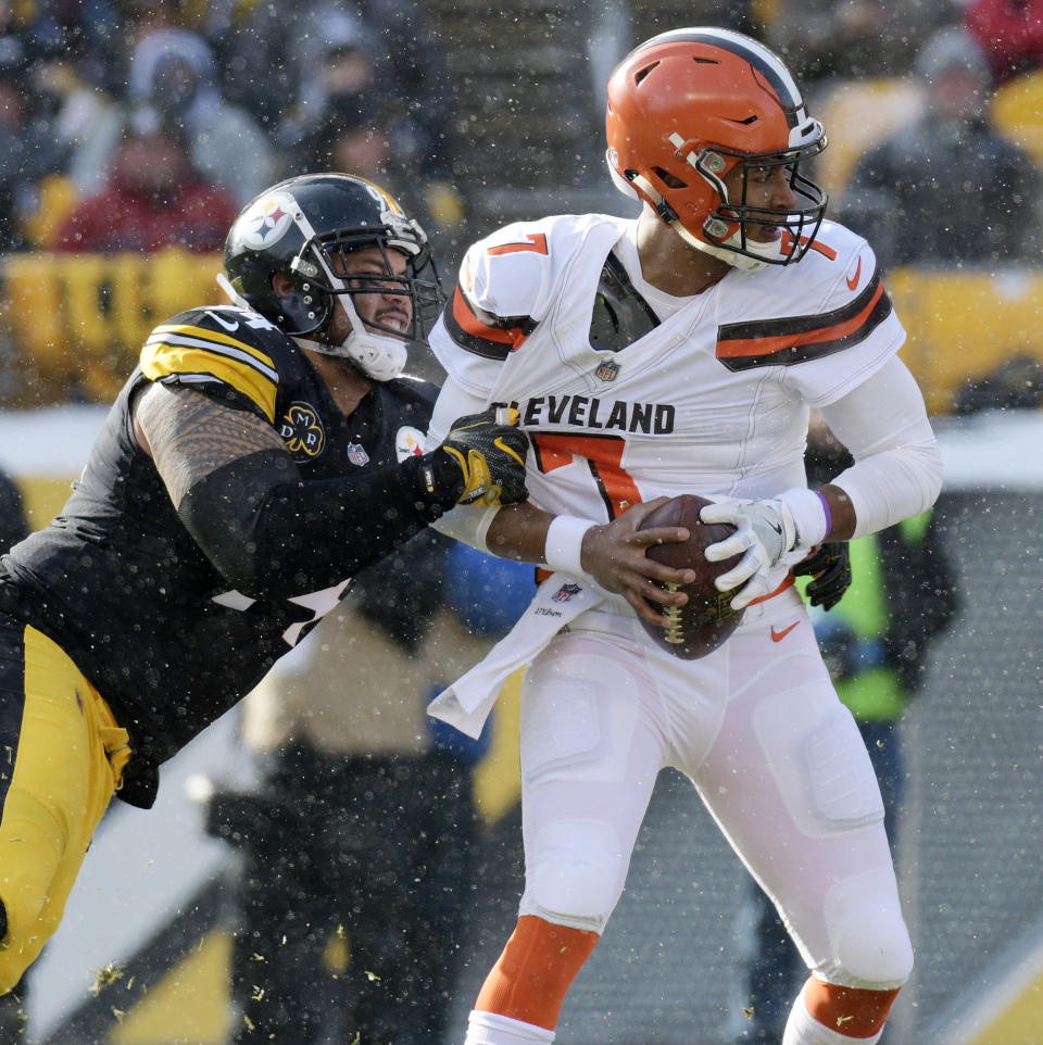 <p>Cleveland Browns quarterback DeShone Kizer (7) is sacked by Pittsburgh Steelers defensive end Tyson Alualu (94) during the first half of an NFL football game in Pittsburgh, Sunday, Dec. 31, 2017. (AP Photo/Don Wright) </p>