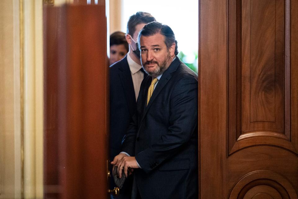 Sen. Ted Cruz, R-Texas, walks out of a meeting room for former President Donald Trump's impeachment lawyers on Feb. 12, 2021, in Washington, D.C.
