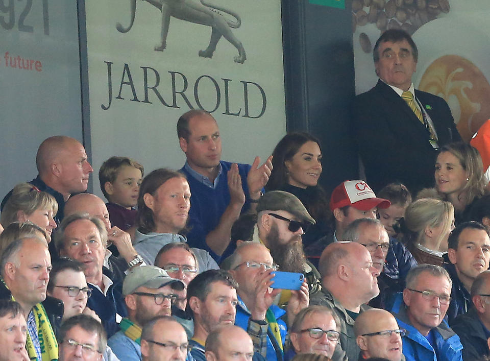 NORWICH, ENGLAND - OCTOBER 05: Prince George of Cambridge,  Prince William, Duke of Cambridge and Catherine, Duchess of Cambridge and Princess Charlotte of Cambridge are seen in the stands during the Premier League match between Norwich City and Aston Villa at Carrow Road on October 05, 2019 in Norwich, United Kingdom. (Photo by Stephen Pond/Getty Images)