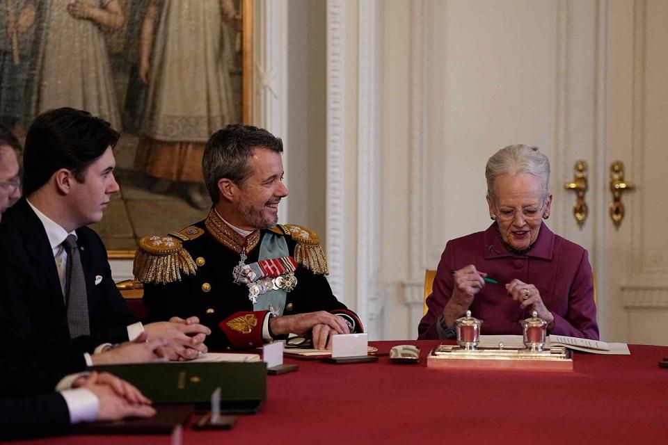 <p>MADS CLAUS RASMUSSEN/Ritzau Scanpix/AFP via Getty </p> King Frederik and Queen Margrethe of Denmark as she signs abdication declaration on Jan. 14, 2024