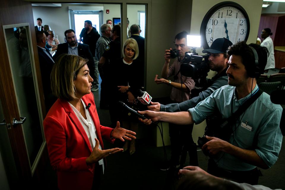 Gov. Kim Reynolds speaks with reporters after a bill signing for House File 424, Wednesday, May 10, 2023, at the Washington County Hospital in Washington, Iowa.