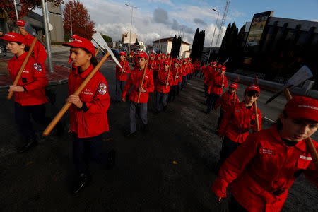 Members of firefighter school march during a training session in Oliveira do Hospital, Portugal November 10, 2018. Picture taken November 10, 2018. REUTERS/Rafael Marchante